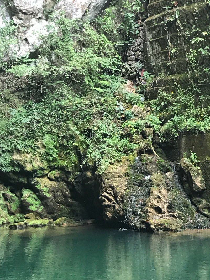 The still green lake below the Santa Cueva cave at Covadonga